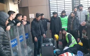 hospital-construction-workers-occupy-entrance-of-contractor’s-hq